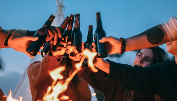 Representational image of people carrying water bottles. — Pexels