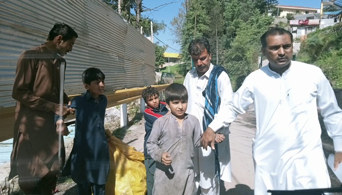 Officials of CPWB Rawalpindi can be seen taking children in their protective custody in this image released on September 25, 2023. — Facebook/Child Protection & Welfare Bureau Rawalpindi