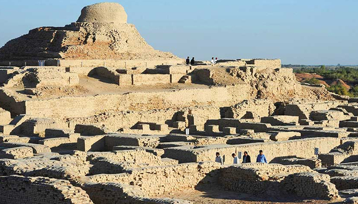 Visitors walk through the UNESCO World Heritage archaeological site of Mohenjo Daro. — AFP/File