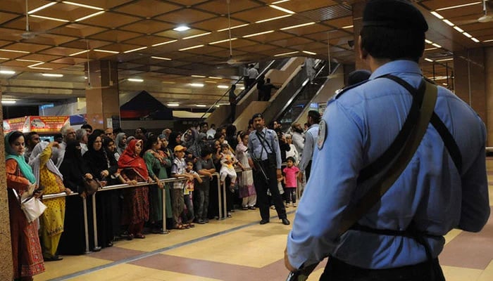 This picture shows Pakistani Airports Security Force personnel standing guard at Jinnah International Airport in Karachi. — AFP/File