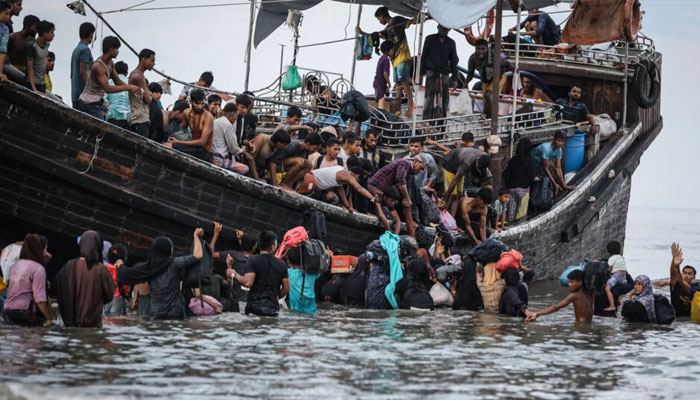 A group of around 250 people from the persecuted Myanmar minority arrived off Aceh province before being turned back to sea. —AFP File