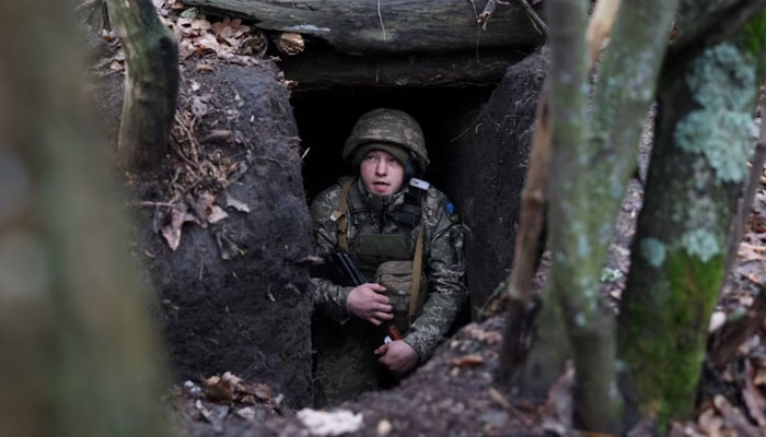 A Ukrainian serviceman looks out from an underground shelter on the frontline near the town of Bakhmut in Ukraines Donetsk region during the Russian invasion of Ukraine, Nov. 18, 2023. —AFP File