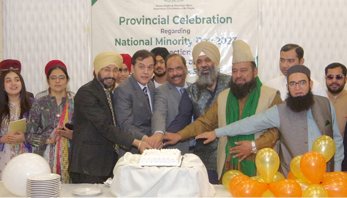 Human Rights and Minority Affairs Secretary Dr M Shoaib Akbar along with Sikh and religious minority members cuts a cake at a ceremony marking the birth anniversary of Baba Guru Nanak on November 18, 2023. — Facebook/Human Rights and Minorities Affairs Department, Government of the Punjab
