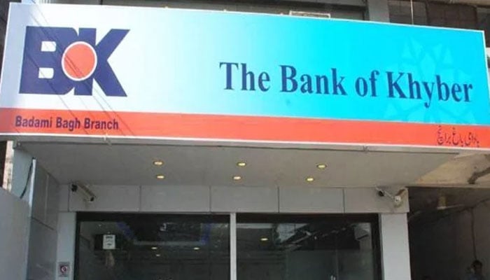 The image shows a signboard at the Bank of Khyber in Badami Bagh, Lahore. — APP File