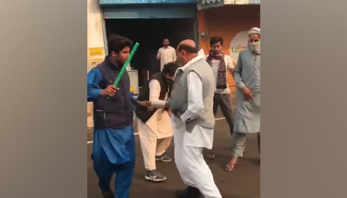 This screengrab taken from a Facebook video released on November 18, 2023, shows a former UC Chairman Mehar Afzal Bharwana being publicly tortured in the Jhang. — Facebook/City41