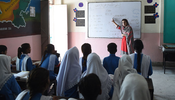 This photograph shows Pakistani students attending a class at a school in Lahore. — AFP/File