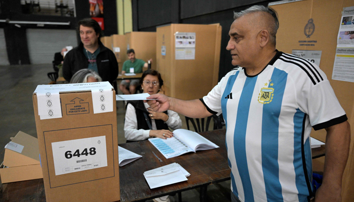 A man casts his vote at a polling station in Buenos Aires, during the presidential election runoff on November 19, 2023. — AFP
