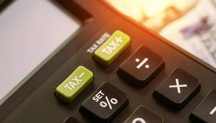 A representational image shows a tax written on a calculator. — AFP/File