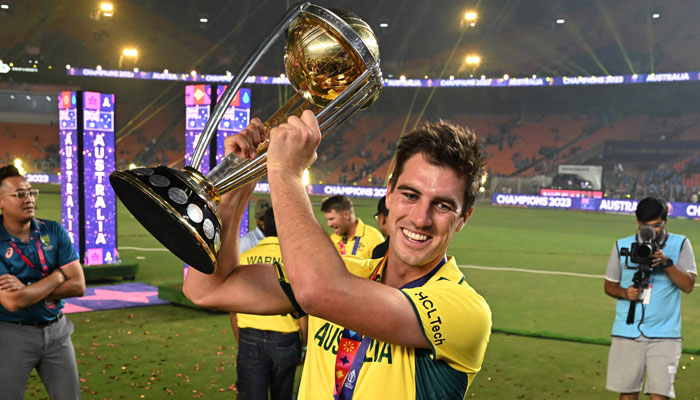 Australia´s captain Pat Cummins poses with the trophy after winning the 2023 ICC Men´s Cricket World Cup one-day international (ODI) final match against India at the Narendra Modi Stadium in Ahmedabad on November 19, 2023. — AFP