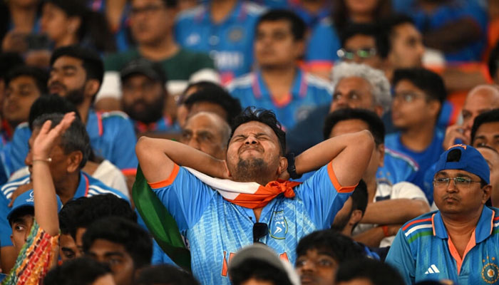 Agony: India fans react while watching their team lose the final.  — AFP File