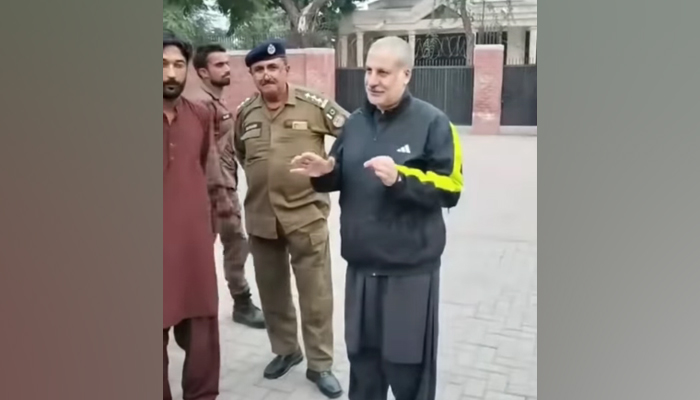 Amjad Khan Niazi, a former MNA of PTI speaks in this still as a Punjab Police official also stands alongside him on November 20, 2023. — Facebook/Amjad Ali Khan PTI Offical