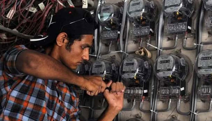 A man seen fixing electricity meters. — AFP/File