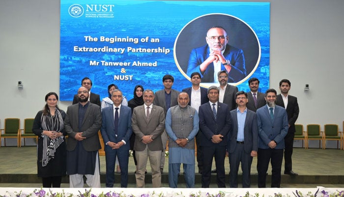 Tanweer Ahmed poses with NUST faculty. — Supplied