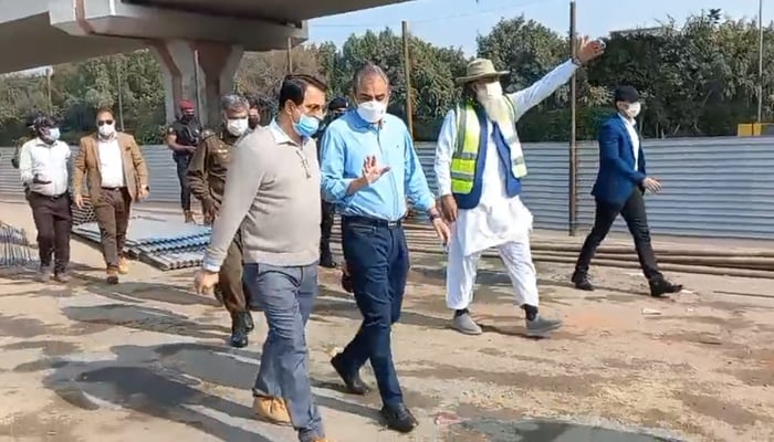 Interim CM Mohsin Naqvi speaks to an official during his inspection of the progress on Walton Road and ADA drain remodeling & upgradation in this still on November 22, 2023. — X/@MohsinnaqviC42