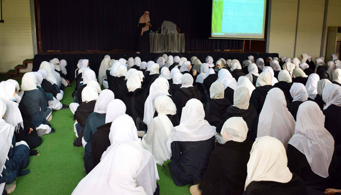 Students look toward the stage as a teacher delivers a presentation during the celebration of Arts and Literature on November 20, 2023. — Facebook/AlHuda International School