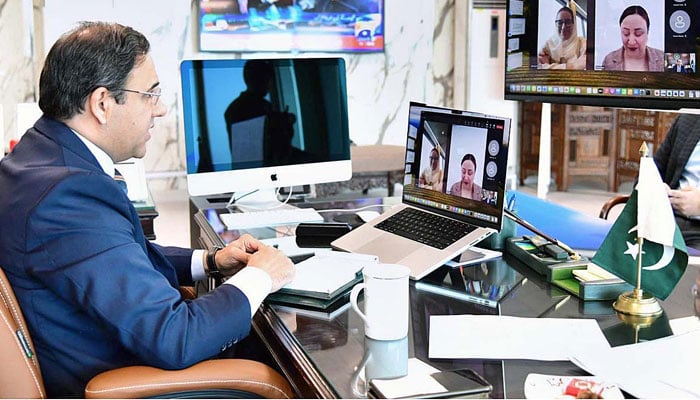 Caretaker Federal Minister for IT and Telecommunication Dr. Umar Saif in a virtual meeting with Secretary General Digital Cooperation Organization (DCO) Ms. Deemah Al-Yahya on Nov 21, 2023. — APP