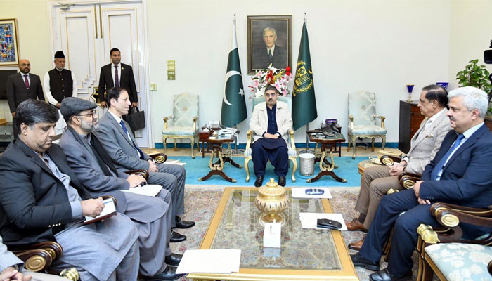 Caretaker Prime Minister Anwaar-ul-Haq Kakar chairs a meeting on power sector reforms in KP and welfare of families of martyrs of war on terror held in Islamabad on Nov 22, 2023. — PID