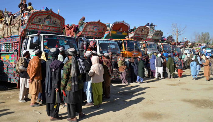 Afghan refugees along with their belongings arrive on trucks from Pakistan, near the Afghanistan-Pakistan border in the Spin Boldak district of Kandahar province on November 20, 2023. — AFP