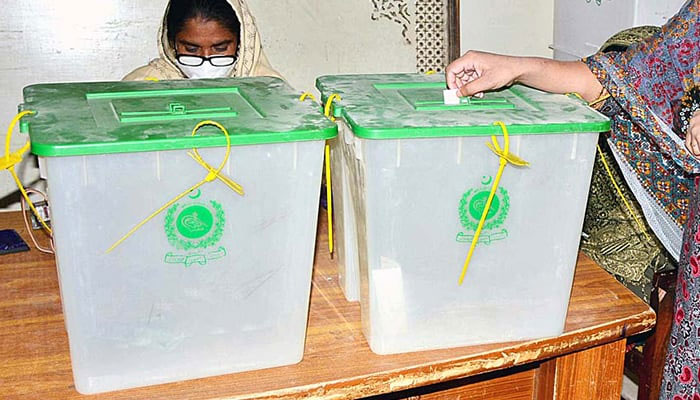 A woman casts her vote in the polling station during an election in Hyderabad, on January 15, 2023. — APP