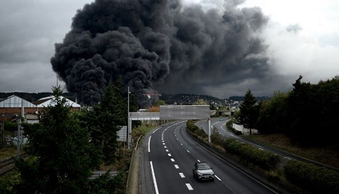 his file photo taken on September 26, 2019, shows smoke billowing from a Lubrizol factory classified SEVESO high-threshold site on fire in Rouen.  . —AFP File