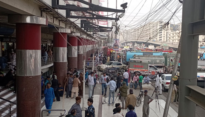 People gathered outside the RJ Mall, a multi-storey shopping mall on one of the city’s busiest arteries, the Rashid Minhas Road on Nov 25, 2023. —Facebook/sirmurad