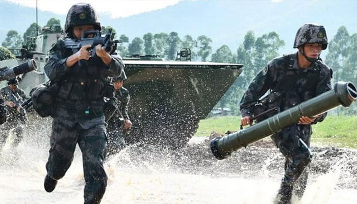 Soldiers from the 74th Army Group of the Peoples Liberation Army take part in drill, in Guangdong province. —Xinhua