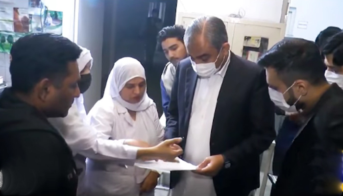 Punjab Caretaker Chief Minister Punjab Mohsin Naqvi interacts with the medical staff during his visit to the Data Darbar Eye Hospital in this still on November 25, 2023. — Facebook/Govt of Punjab