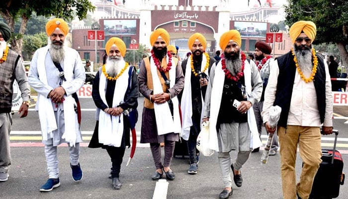 A large number of Sikh Yatrees arrived in Pakistan to participate in religious rituals on the occasion of the 554th Birth Anniversary of Guru Nanak at Nankana Sahib on Nov 25, 2023. — APP