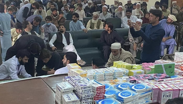 People sit in a hall during a free medical camp for special persons on November 11, 2023. — Facebook/Bajaur youth organisation