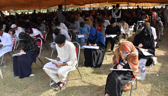 Students can be seen attempting the MDCAT exam in the KMU on November 26, 2023. — Facebook/Khyber Medical University, Peshawar, Khyber Pakhtunkhwa