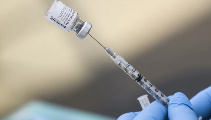 A representational image shows a syringe filled with a dose of a COVID-19 vaccine. — AFP/File