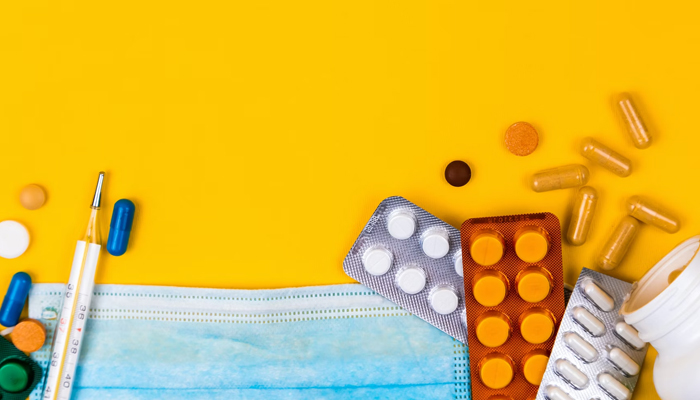 A representational image showing a number of medicines with a thermometer. — Unsplash/File