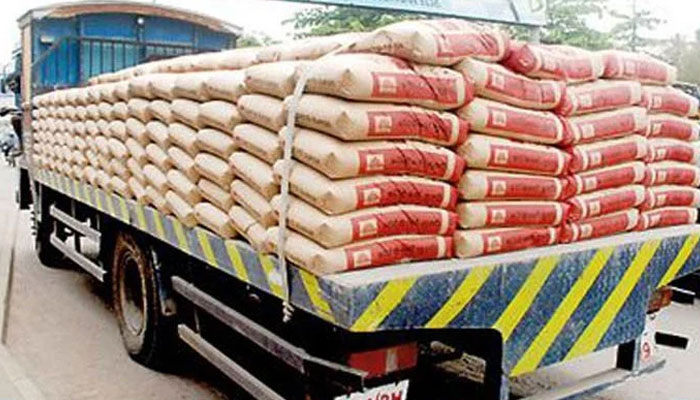 The image shows a truck carrying sacks of cement.  — APP File