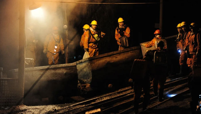 Rescue workers enter the coal mine in Chinas Heilongjiang province. — AFP File