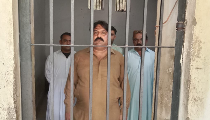 This image shows four police officers behind bars who were charged with corruption on November 28, 2023. — Facebook/Sindh Police