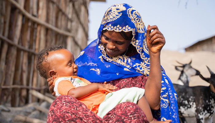In this picture, a mother holding her child in her arms can be seen on November 28, 2023. —Facebook/United Nations Development Programme - UNDP