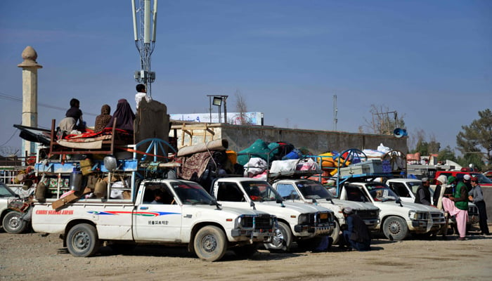 Afghan refugees with their belongings loaded on vehicles gather outside a registration centre upon arriving from Pakistan near Spin Boldak in Kandahar on November 28, 2023. — AFP