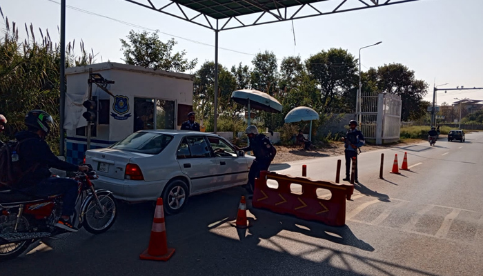 Islamabad Police officials check a vehicle at a checkpoint on November 28, 2023. — Facebook/Islamabad Police
