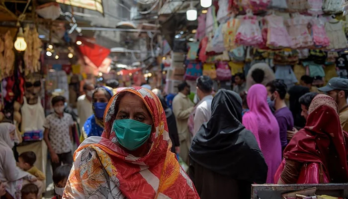 Women shop at a market after the government eased the lockdown imposed as a preventive measure against the coronavirus, in Rawalpindi. — AFP/File