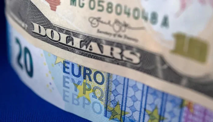 This representational image shows a dollar and a Euro note. — AFP/File