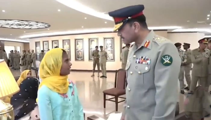 Chief of Army Staff General Asim Munir speaks with a girl in this still on November 30, 2023. — X/@PakistanFauj