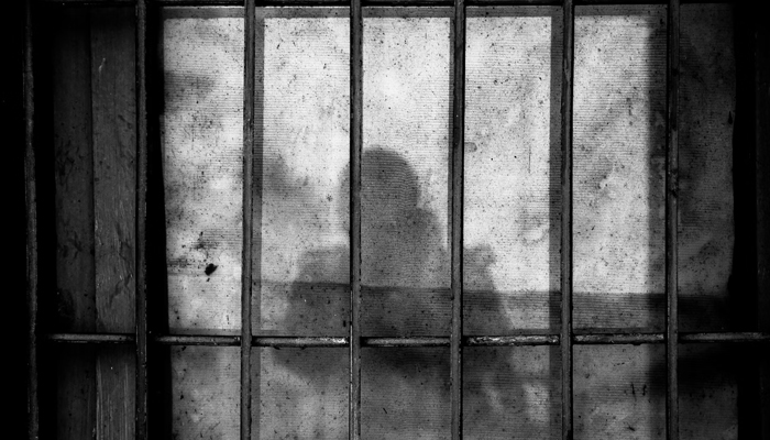 This representational image shows a shadow on the jail bars. — Unsplash/File