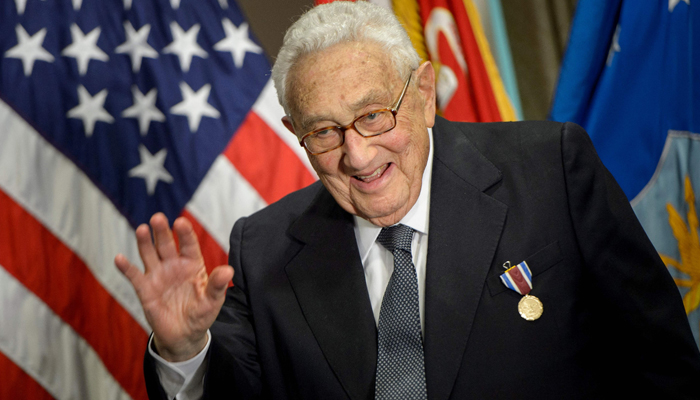 Former US Secretary of State Henry Kissinger waves after receiving an award during a ceremony at the Pentagon honoring his diplomatic career May 9, 2016 in Washington, DC. — AFP