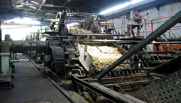 The image shows an inside view of an unnamed sugar mill. —APP File