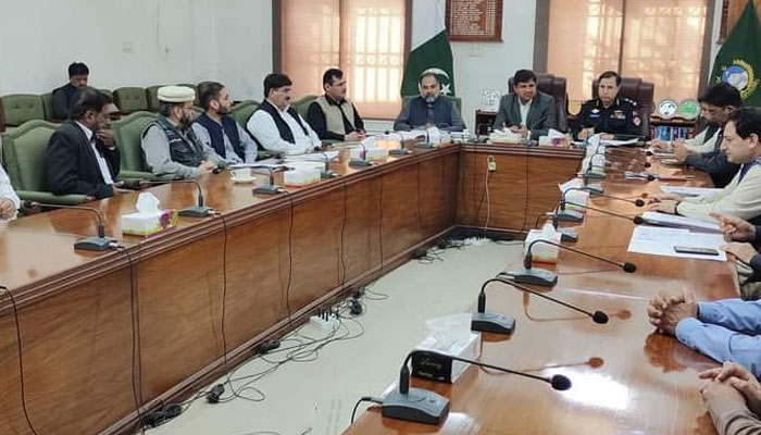 Commissioner Dera Ismail Khan Division Zafarul Islam Khattak (c) presides over a meeting regarding the arrangements for the general elections on November 30, 2023.—Facebook/Deputy Commissioner DIKhan