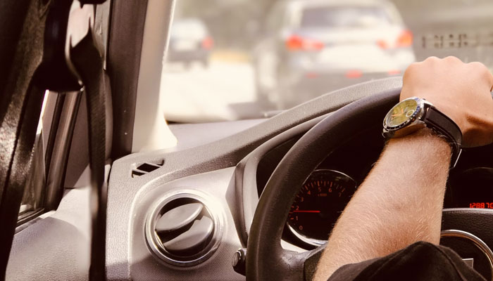 Representational image of a person driving a car. — Unsplash