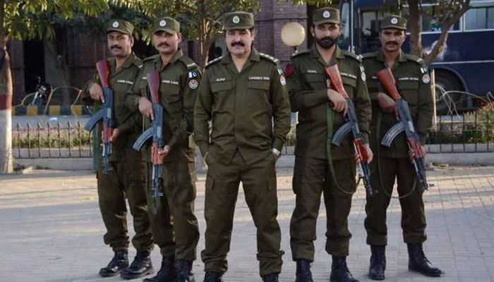 The Punjab police personnel pose for a photo. — APP File