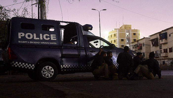 Police partake in an operation against terrorists in Karachi on February 17, 2023. — AFP