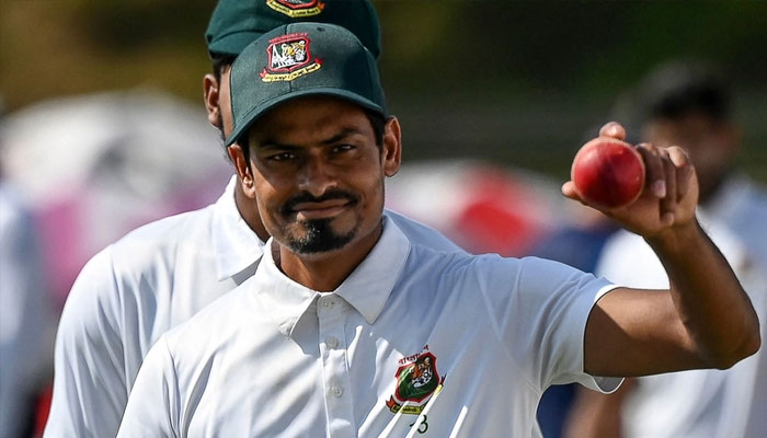 Bangladesh’s Taiul Islam acknowledges the crowd after getting six wickets during the first Test cricket match between Bangladesh and New Zealand at the Sylhet International Cricket Stadium in Sylhet on December 2, 2023.—AFP