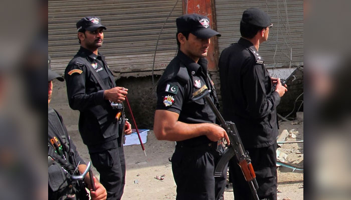 Police officials stand alert with their weapons.—AFP/FILE